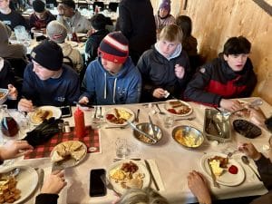 Students having dinner at the sugar shack