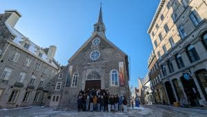 student group poising in front of a chapel in quebec city