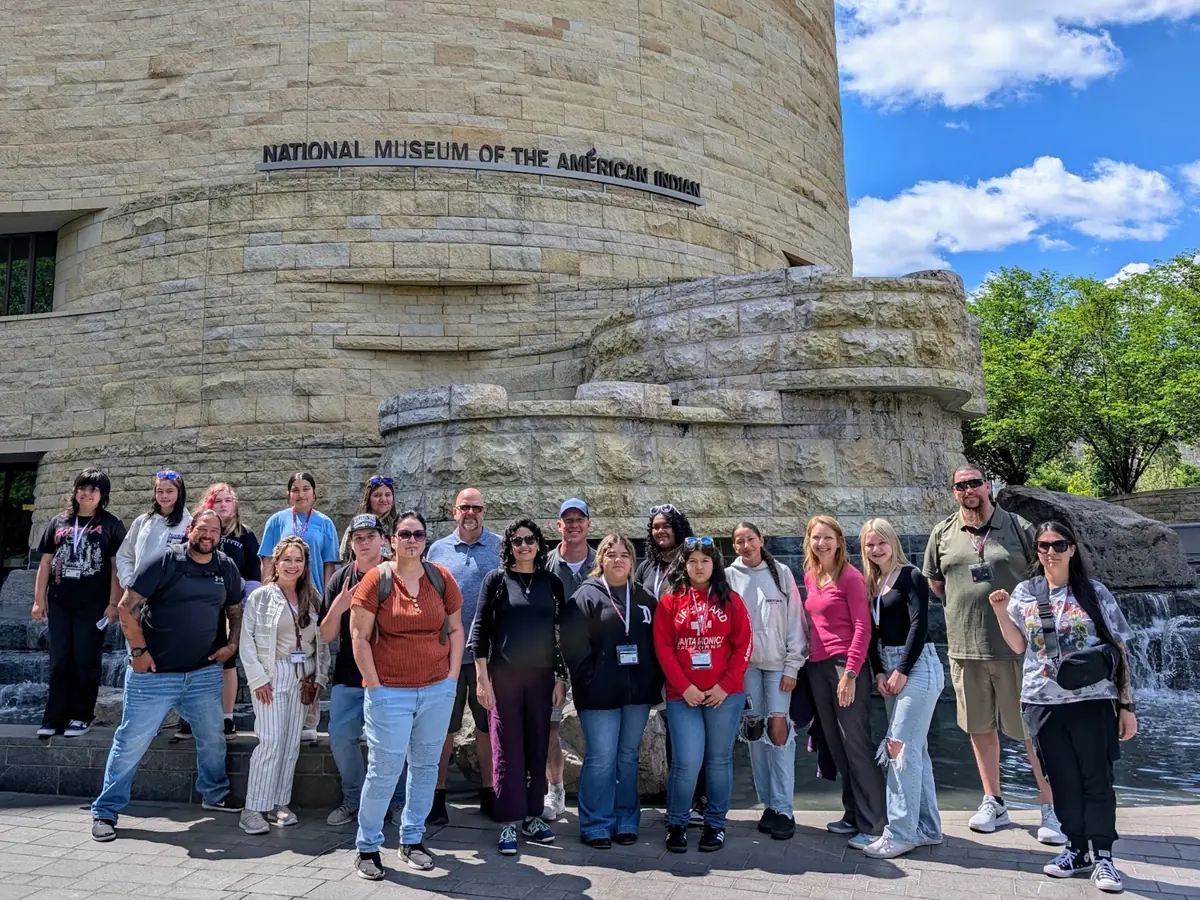 A Landmark group standing together outside the National Museum of the American Indian in Washington, DC