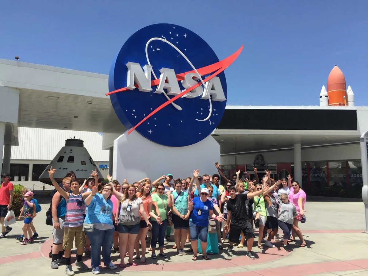 A Landmark student group gathered at the NASA sign outside the Kennedy Space Center Visitor Complex in Florida