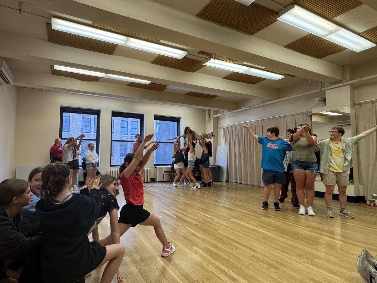 Students taking part in a Broadway dance workshop in a New York studio