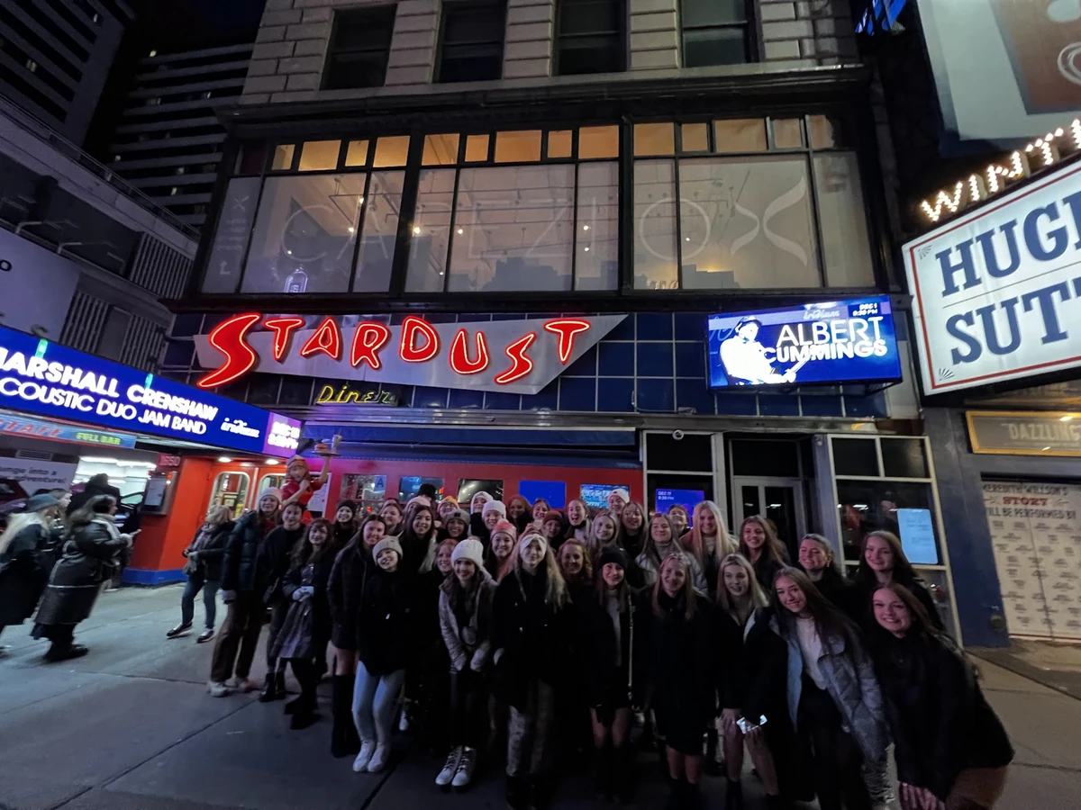 A Landmark student group in the Broadway theater district in the evening
