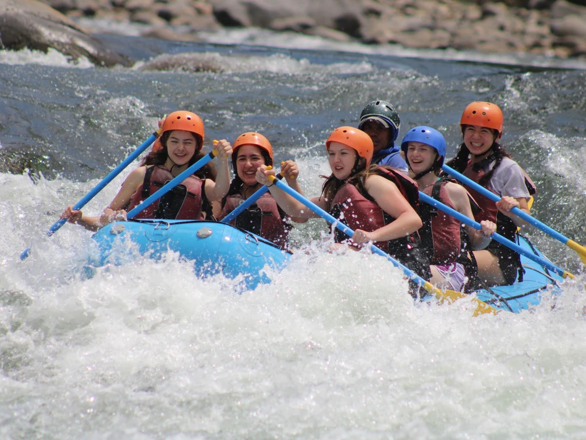 Landmark students paddling a raft through whitewater on the Sarapiquí River in Costa Rica