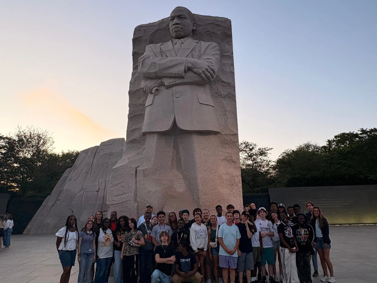 A Landmark student group at the Martin Luther King, Jr. Memorial at dusk