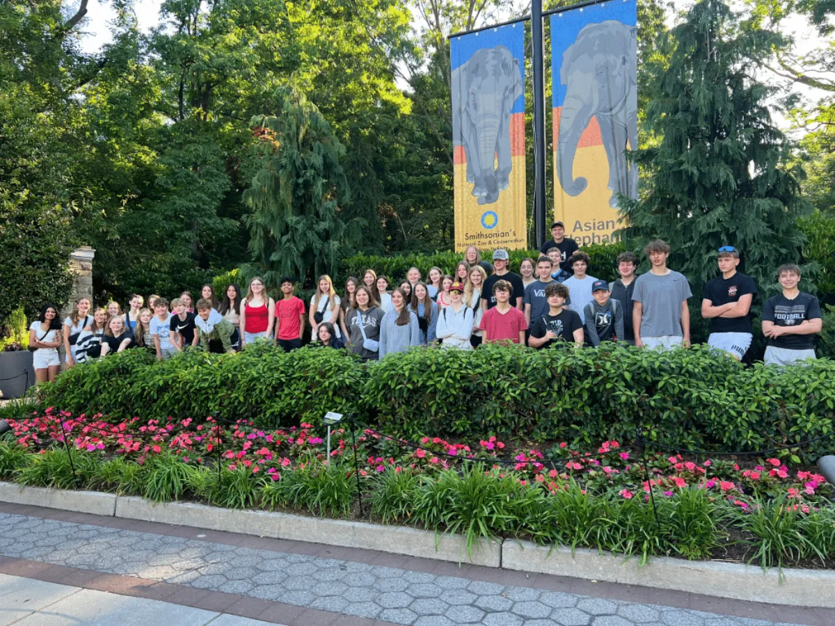 Students and chaperones from a Landmark school group at the entrance to the Smithsonian National Zoo in Washington, DC