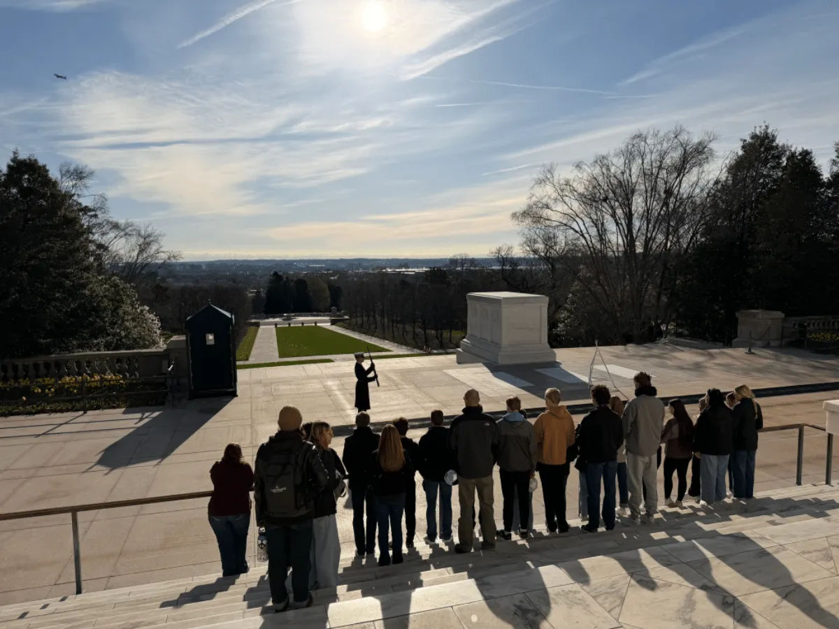 A Landmark student group watching the ceremonial guard at the Tomb of the Unknown Soldier in Arlington National Cemetery