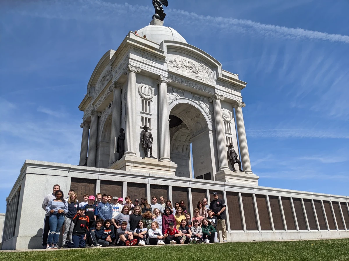 A Landmark student group seated at the Pennsylvania State Memorial at Gettysburg