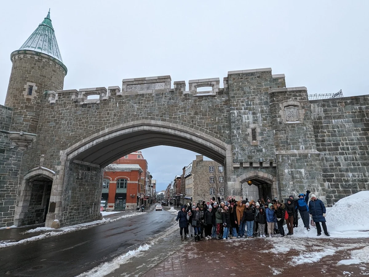 A Landmark student group at the Porte Saint-Jean gate in Quebec City in winter