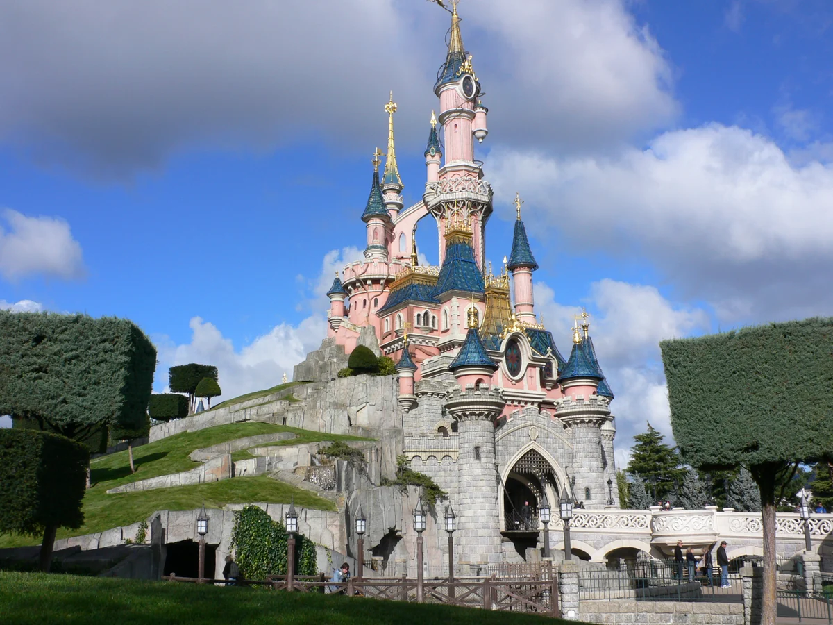 Sleeping Beauty Castle at Disneyland Paris under a blue sky