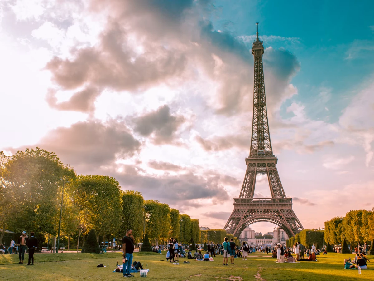 The Eiffel Tower seen from the Champ de Mars in Paris at sunset