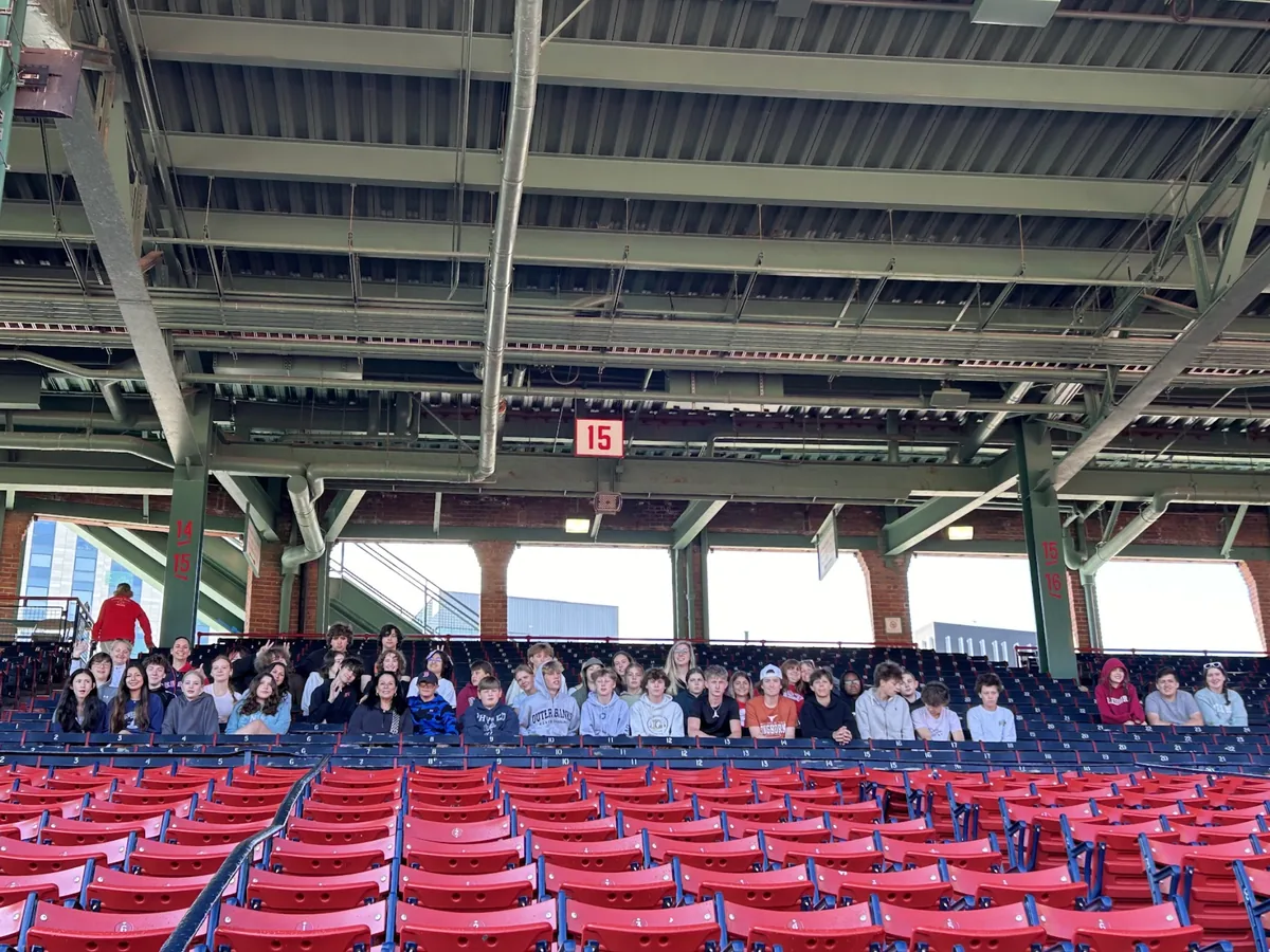 A student group seated in the stands at Fenway Park in Boston