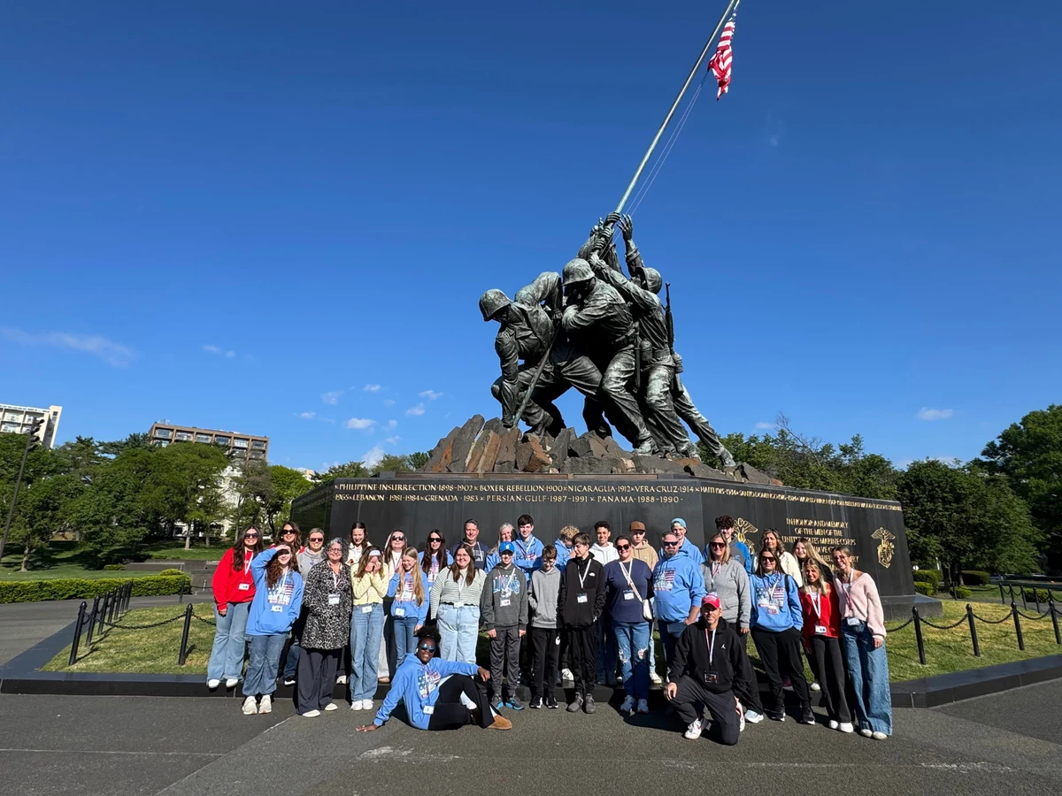 A Landmark school group wearing name badges photographed at the Marine Corps War Memorial near Washington, DC