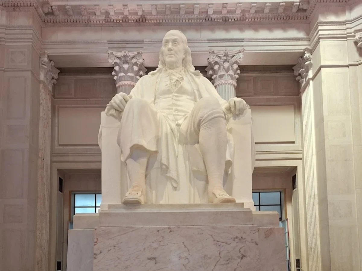 The twenty-foot marble statue of Benjamin Franklin seated in the domed rotunda of the Benjamin Franklin National Memorial