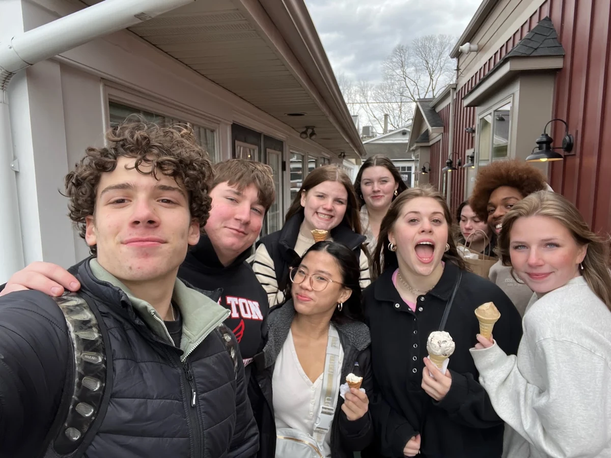 A group of students smiling together during a break on a Landmark school trip