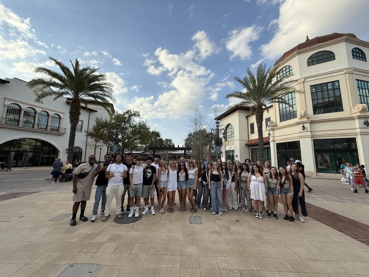 A large Landmark student group photographed at Disney Springs in Orlando, Florida on a bright spring afternoon