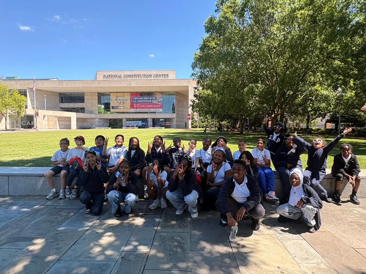 A Landmark student group posed on the lawn in front of the National Constitution Center in Philadelphia