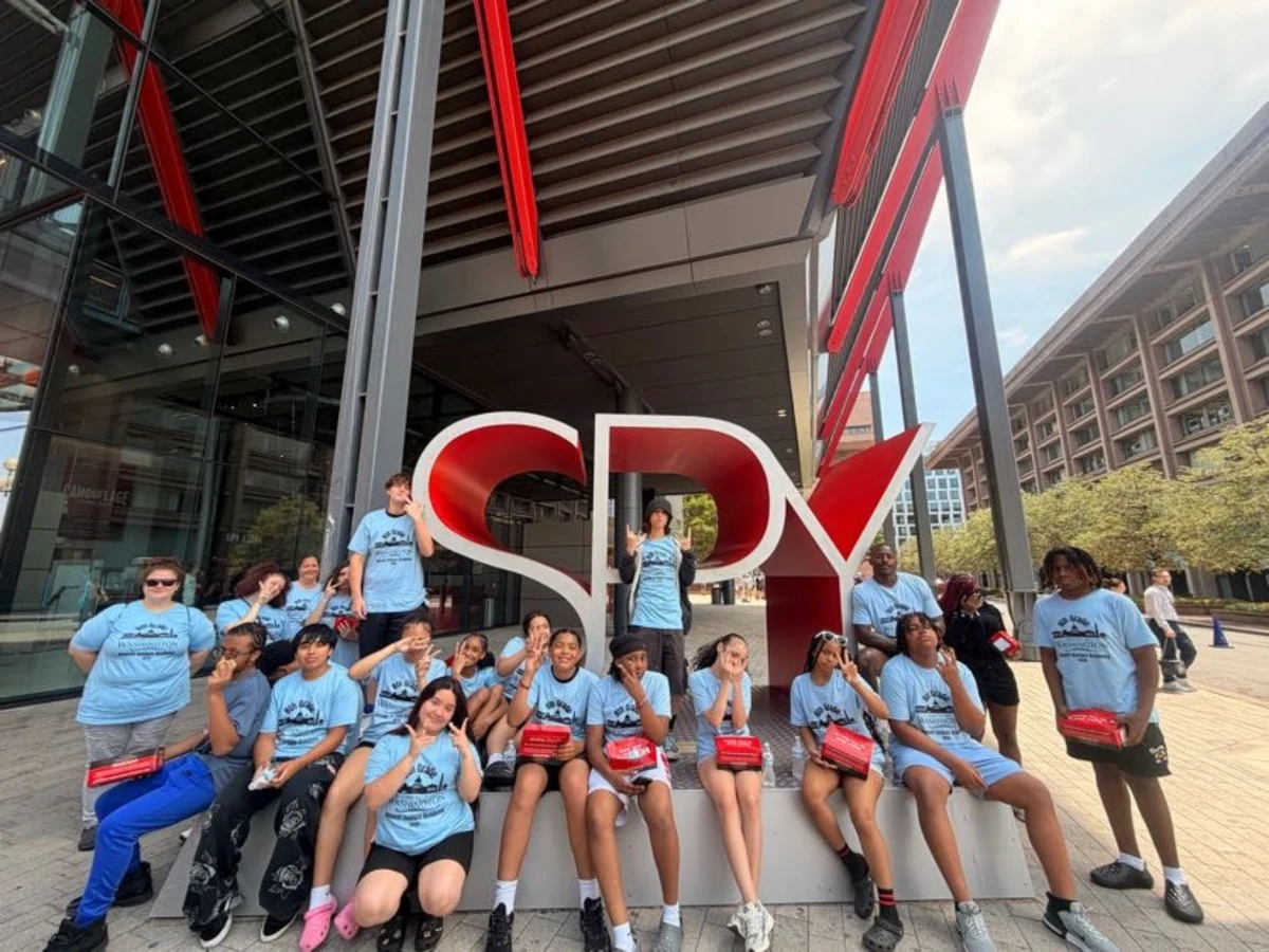 A Landmark student group in matching trip T-shirts outside the International Spy Museum in Washington, DC