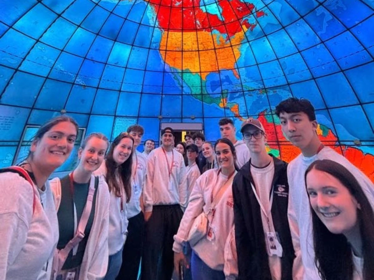 Students inside the Mapparium, the stained-glass globe at the Mary Baker Eddy Library in Boston