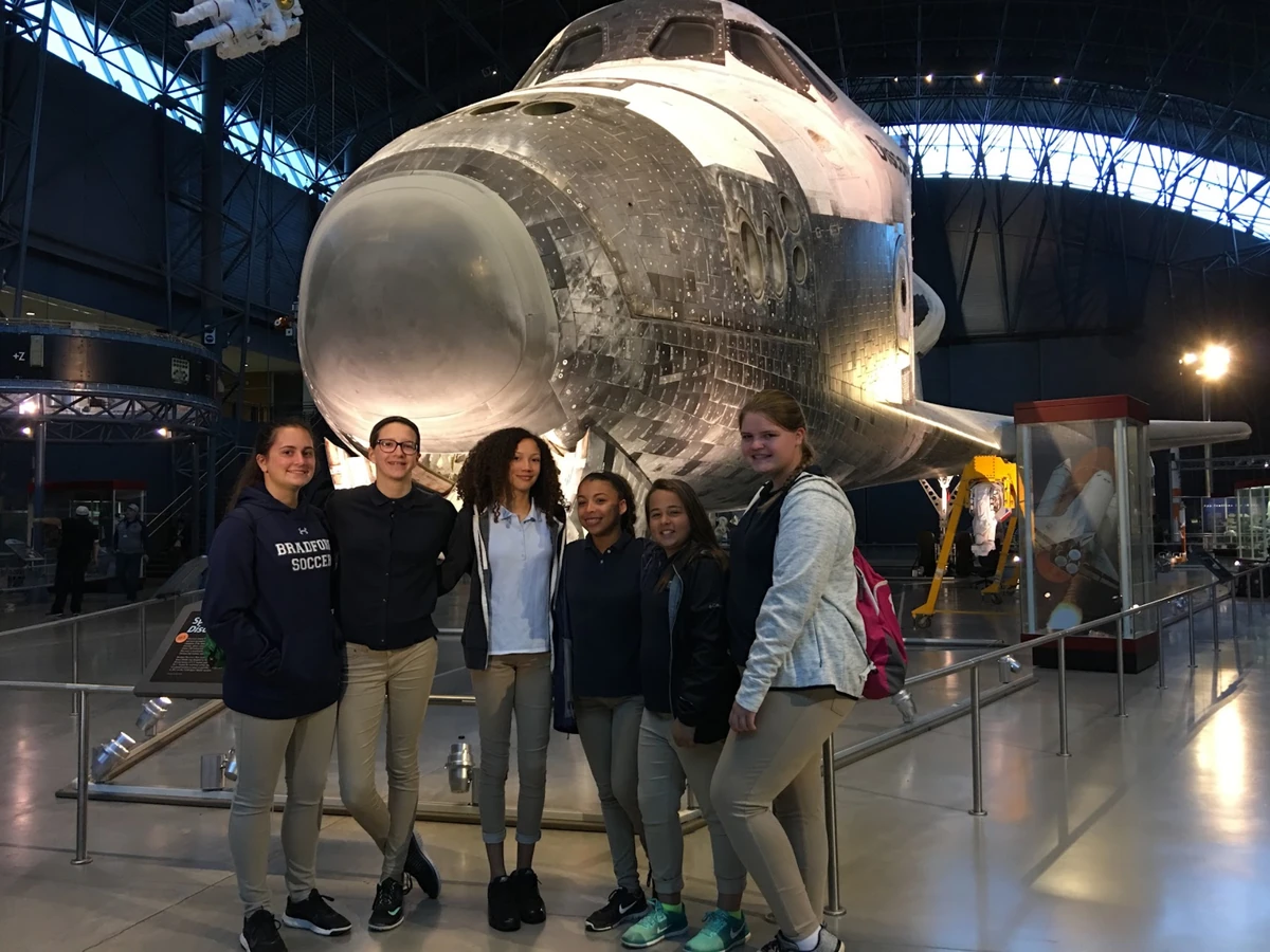 Landmark students standing in front of Space Shuttle Discovery at the Smithsonian Udvar-Hazy Center
