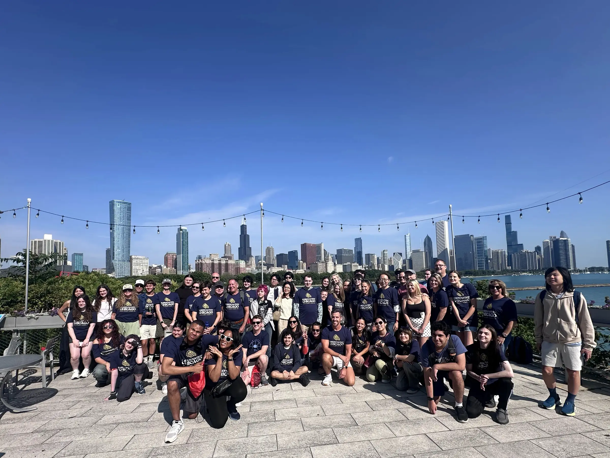 A Landmark student group by Lake Michigan with the Chicago skyline behind them