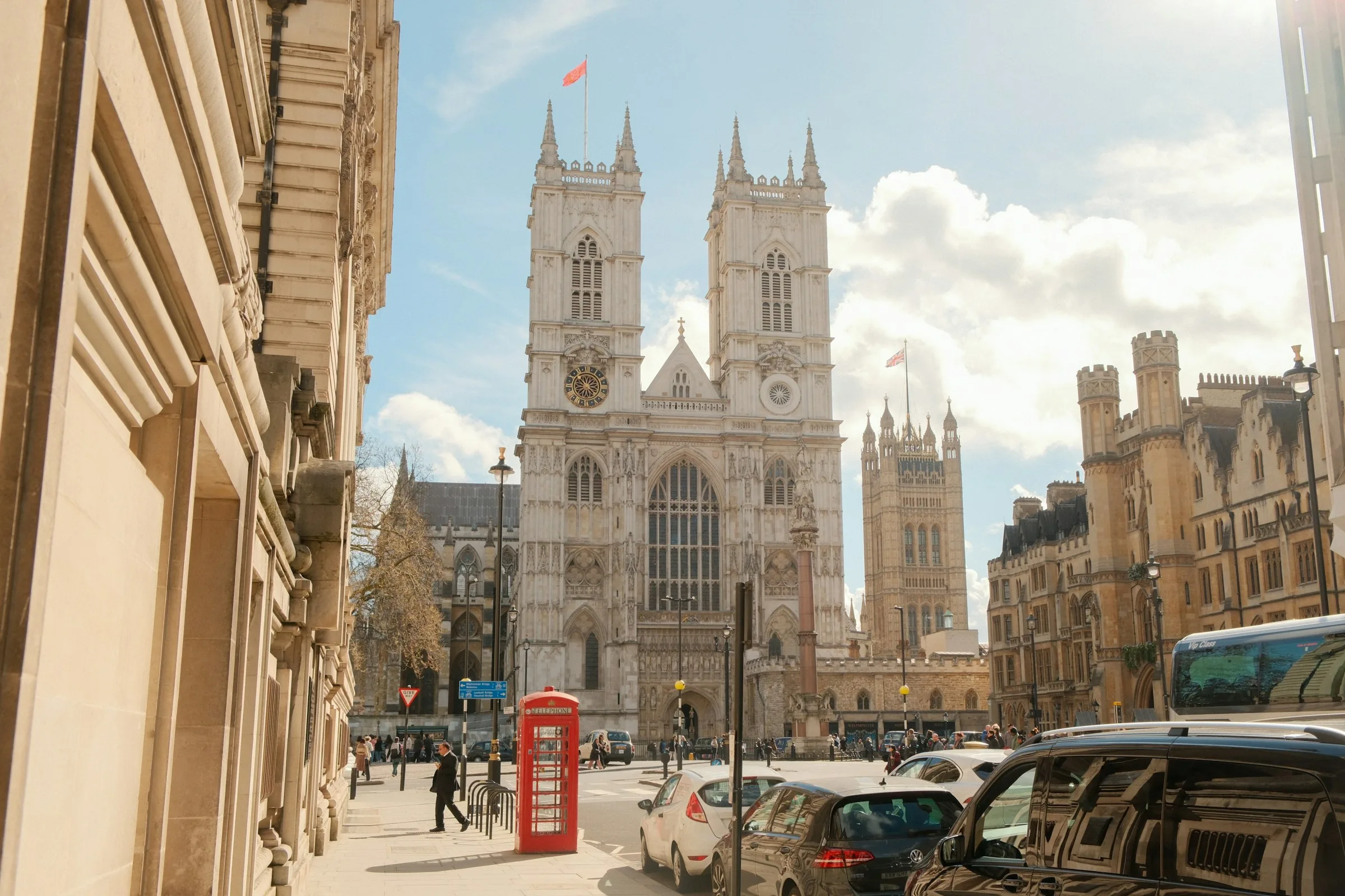 Westminster Abbey and a red telephone box on a London street