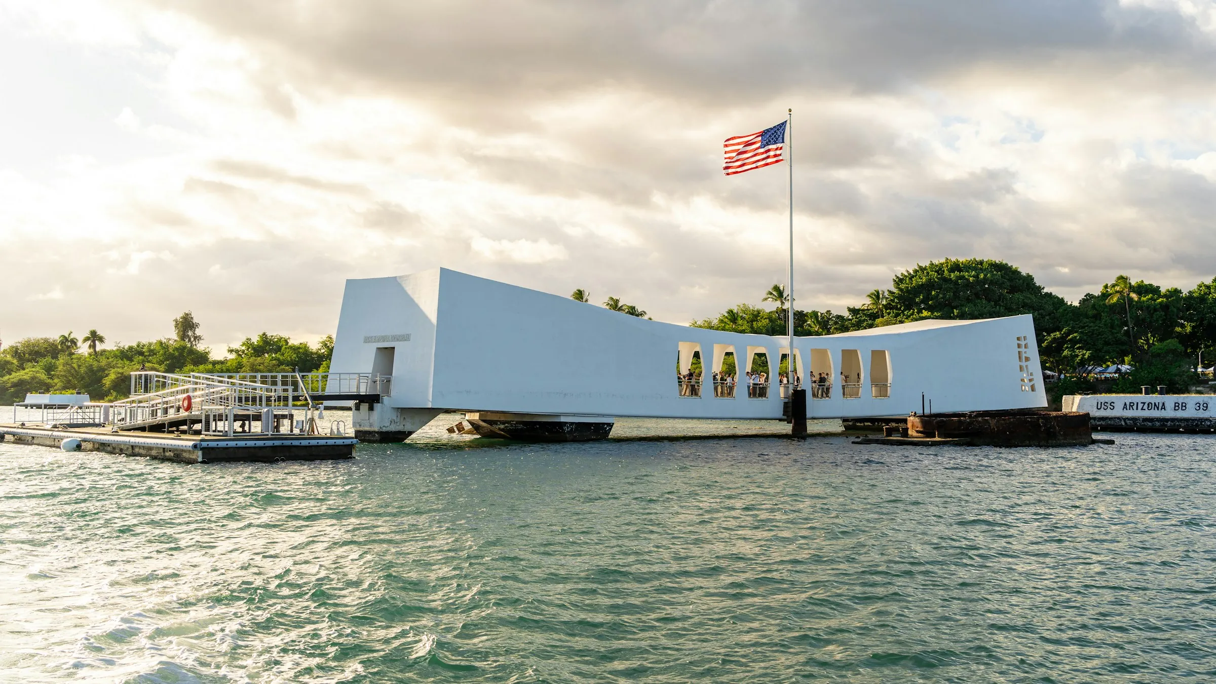 The USS Arizona Memorial spanning the sunken battleship at Pearl Harbor