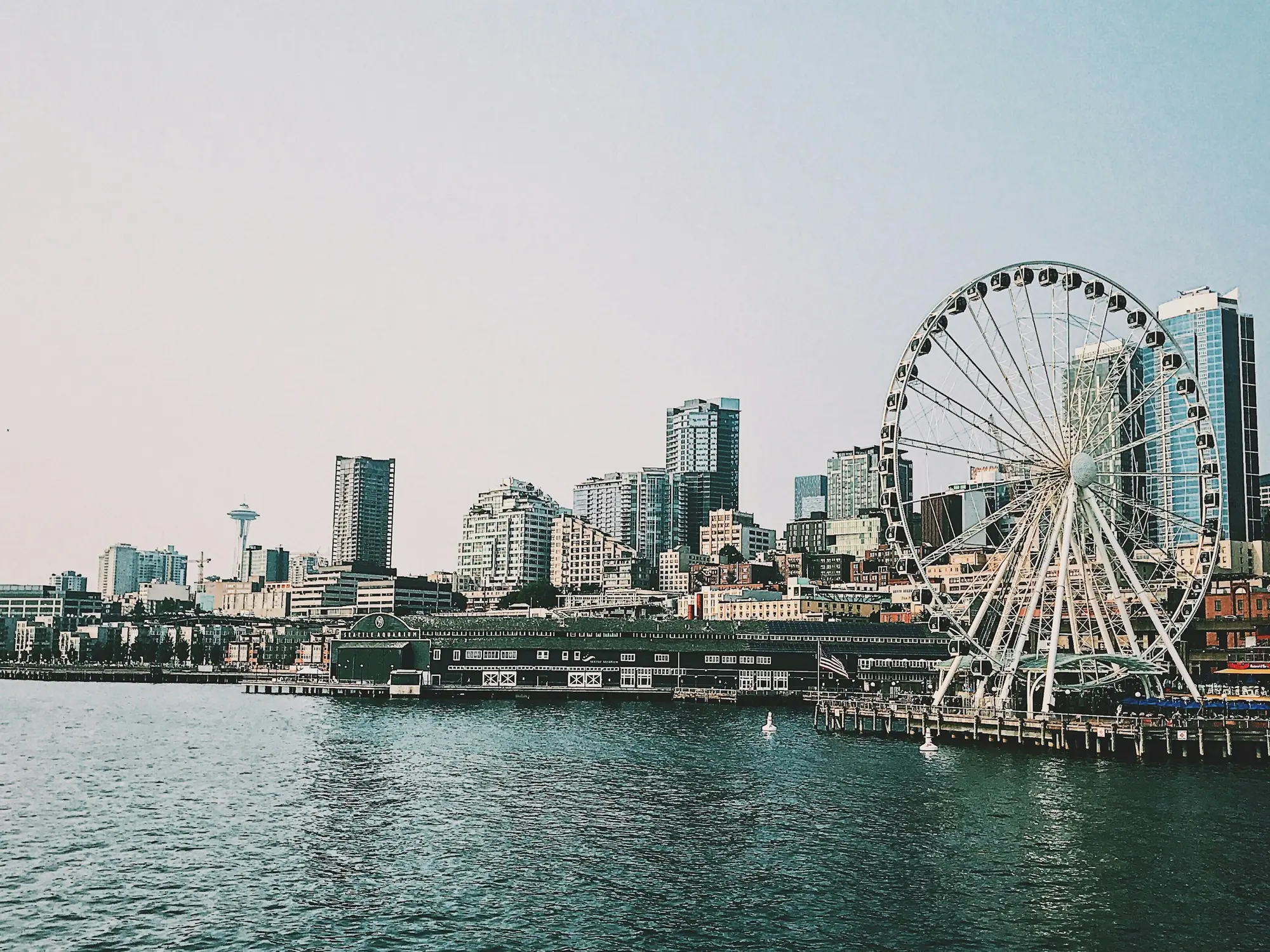 The Seattle waterfront on Elliott Bay, with the Great Wheel and the Space Needle