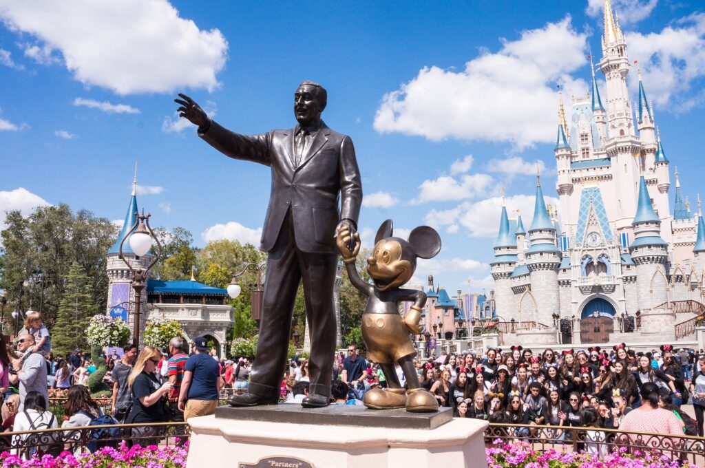 Walt Disney statue with Mickey Mouse in Magic Kingdom.