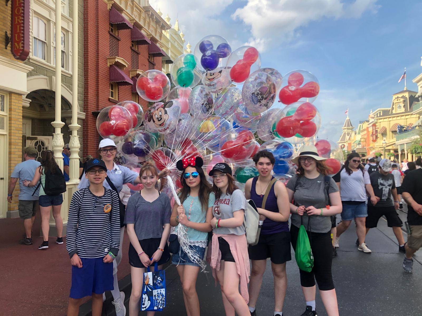Students with the Walt Disney World balloons in Magic Kingdom.