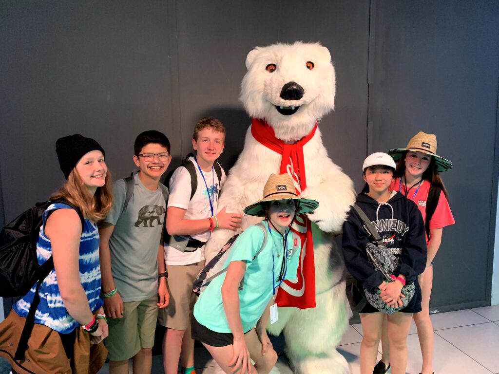 Students with a bear in Walt Disney World
