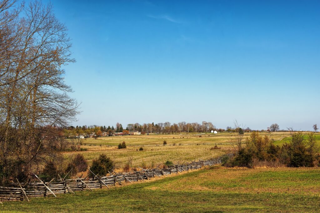 Green fields of Gettysburg and blue sky