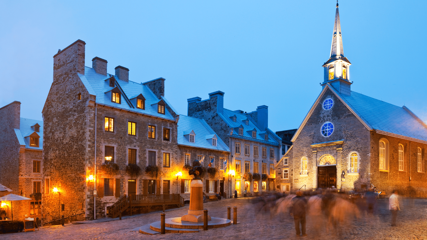 the place royale in quebec city at dusk with a small chapel in background