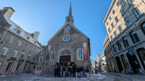student group poising in front of a chapel in quebec city
