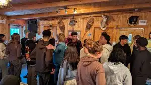 Students learning the folk dance at the sugar shack