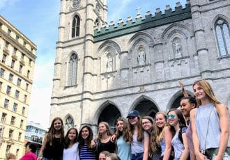 students in front of Notre Dame Basilica in Montreal