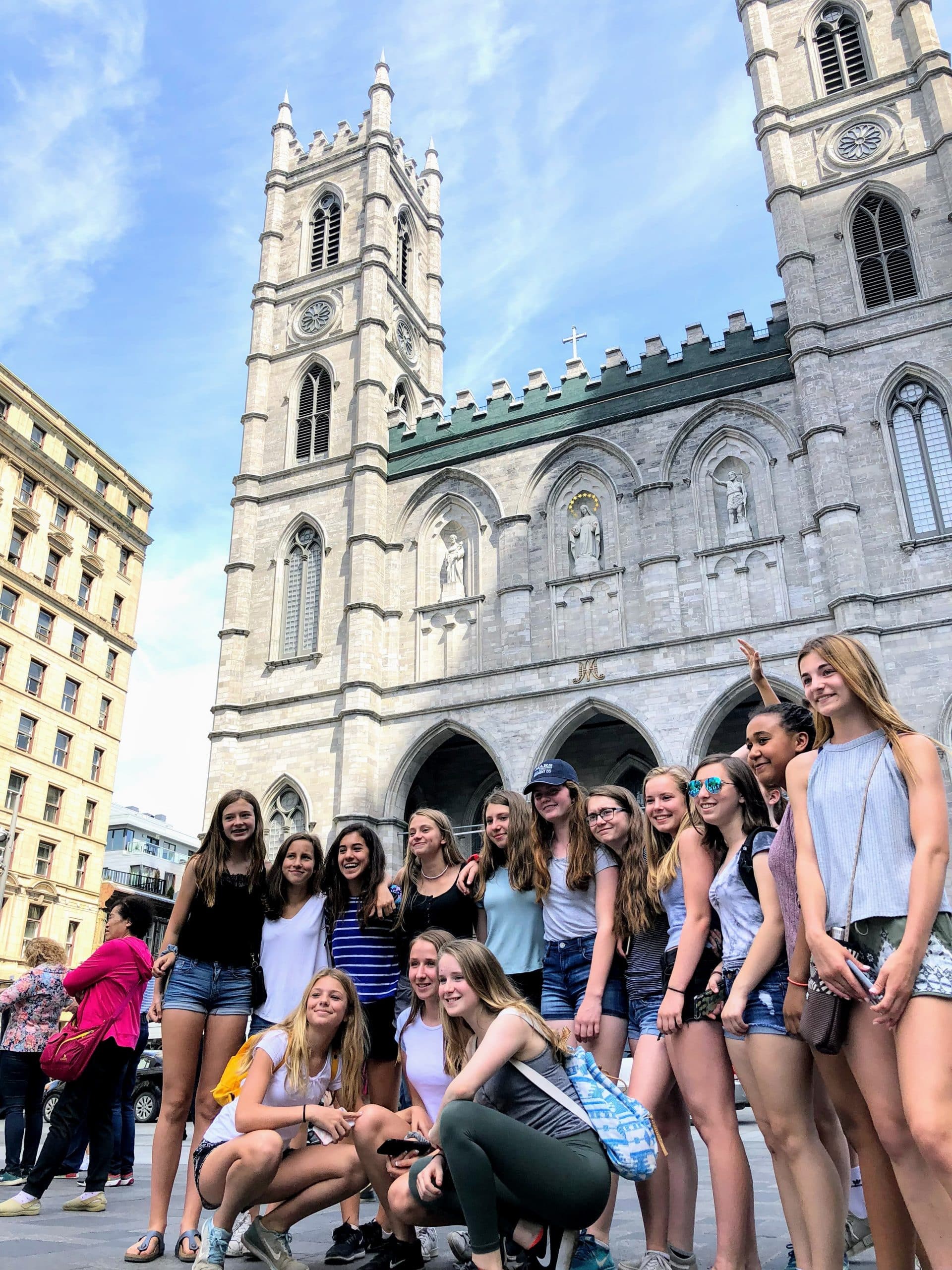 students in front of Notre Dame Basilica in Montreal