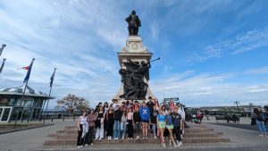 students in front of the champlain statue in quebec city